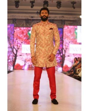 Cherry blossom printed beige Sherwani with red silk trouser