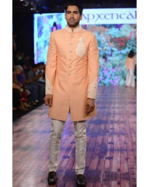 Peach Sherwani with white trouser and white pocket square