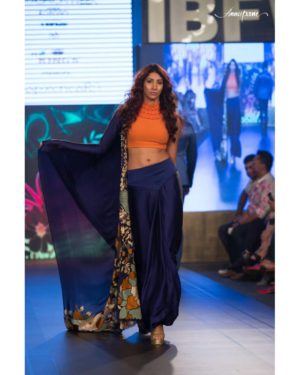 Blue silk georgette saree with floral bird embroidered & textured neck orange blouse