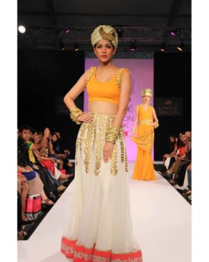 Cream akshar georgette skirt with bright orange blouse & golden dupatta