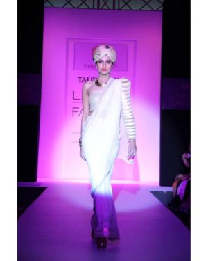 Cream georgette saree with golden border & pleated one sleeve blouse