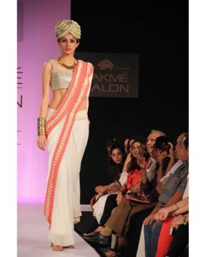 Cream georgette saree with pleated texture & silver sequence blouse