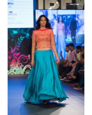 Pink embroidered net choli with flared satin georgette skirt