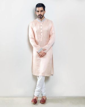 Peach kurta with silver zardosi embroidery and offwhite churidar